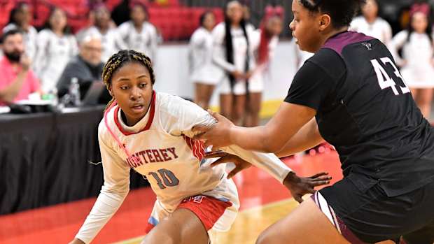 Lubbock-Monterey's Ambrosia Cole dribbles the ball against Mansfield Timberview's Zoi McClellan during the Region I-5A Girls Basketball Tournament at Kay Yeager on Friday, February 24, 2023. BKG-LUBBOCKMONTEREY-MANSFIELDTIMBERVIEW